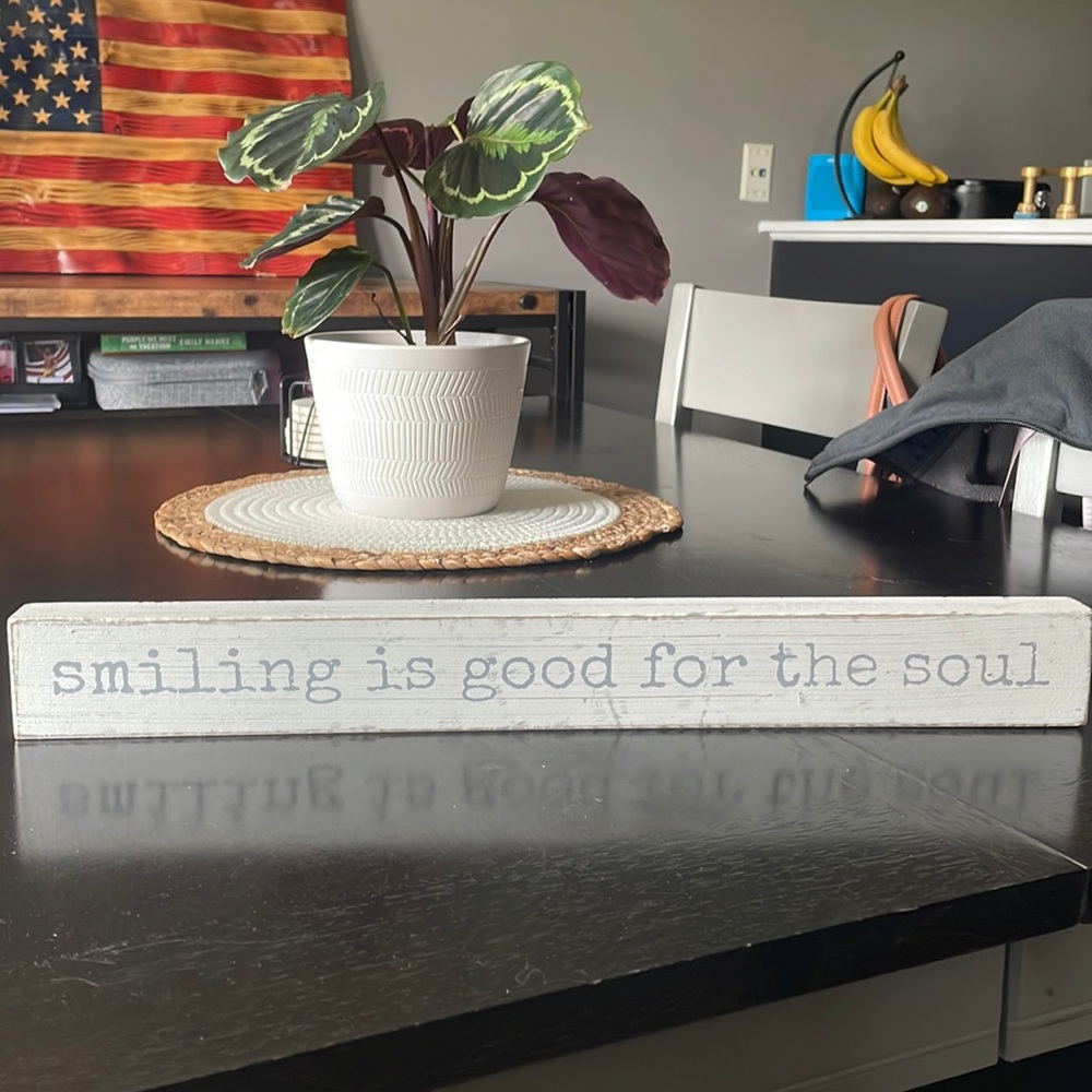 Smiling is good for the soul sign